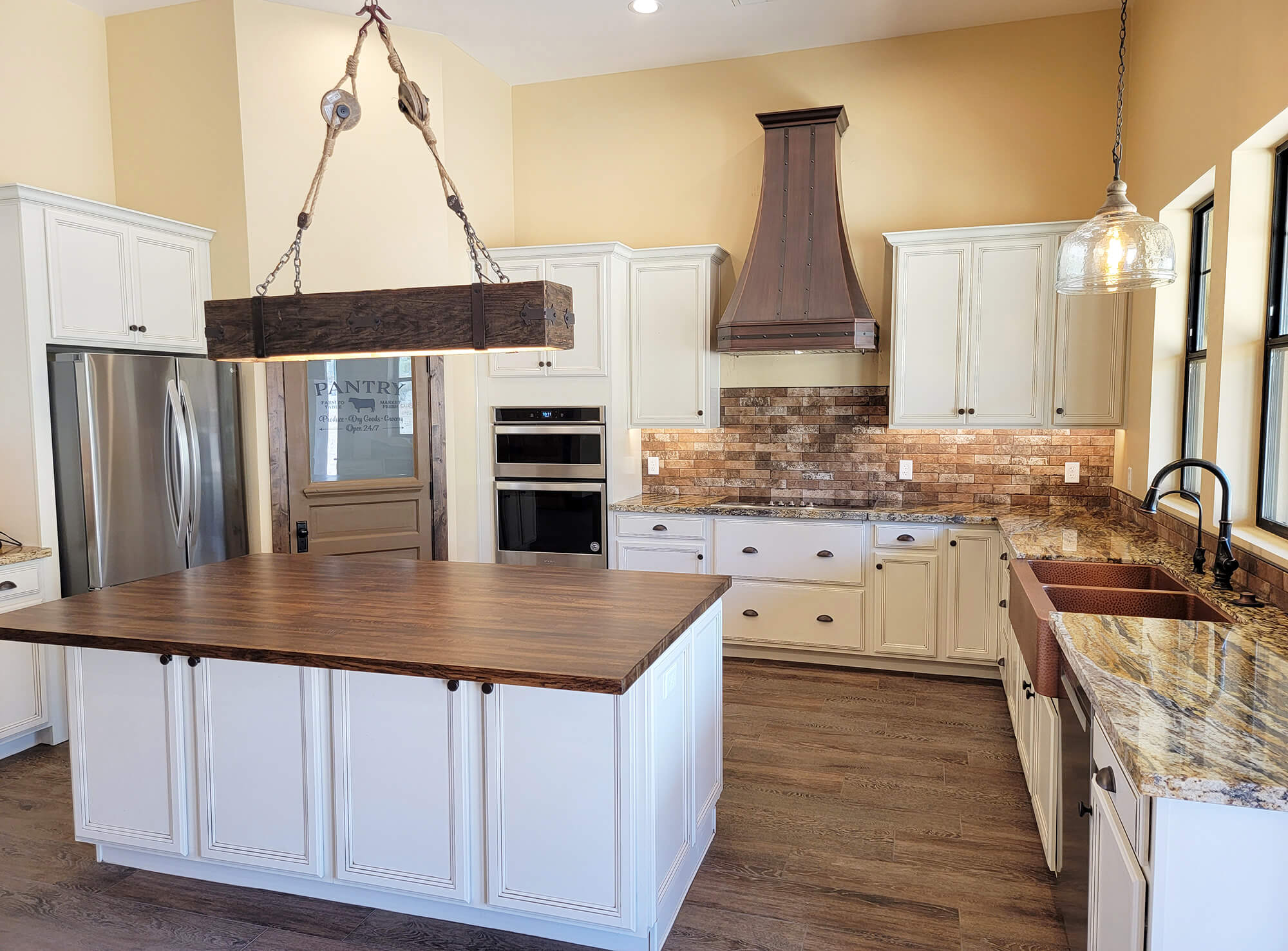Master bath with double sink and granite counters in custom home by Resurrection Builders.